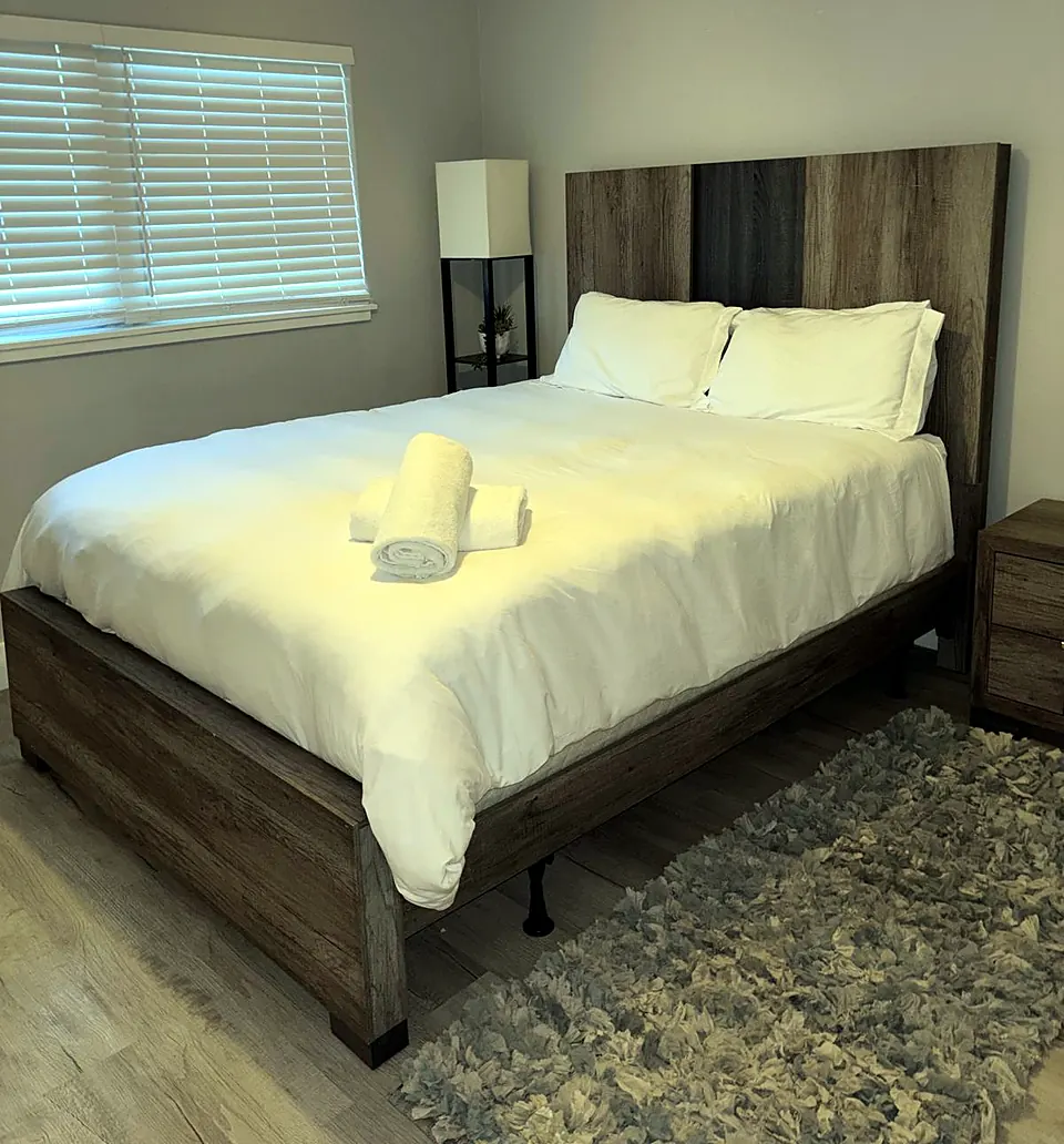 Bedroom with fresh linens after a cleaning